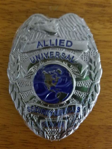 The dimensions of the <b>badge</b> are 3 ⅜" x 2 ¼". . Allied universal badge for sale